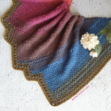 scarf on marble background with flower on top thumbnail