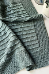 Knit blanket on a surface thumbnail