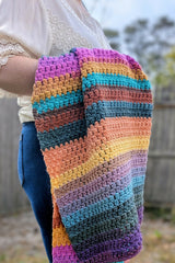 Crochet Blanket Held By A Woman thumbnail