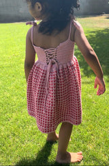Crochet Dress Worn By A Girl On A Garden Back View thumbnail