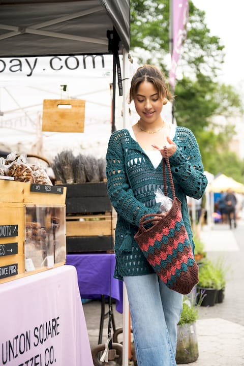 Woman crocheting a cotton market bag