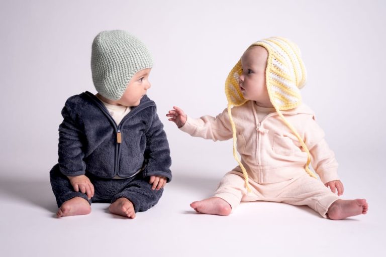 Woman hand-crocheting soft baby blanket