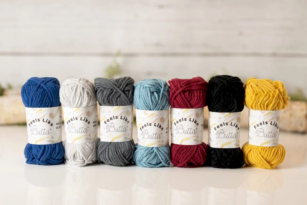 Woman testing softened acrylic yarn sample